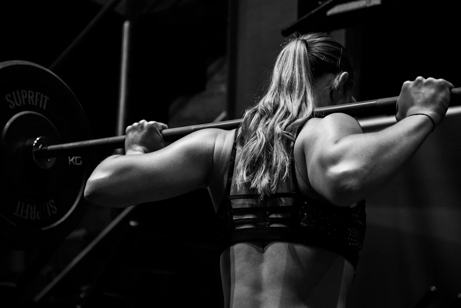 Gym owner guiding a member on financed equipment