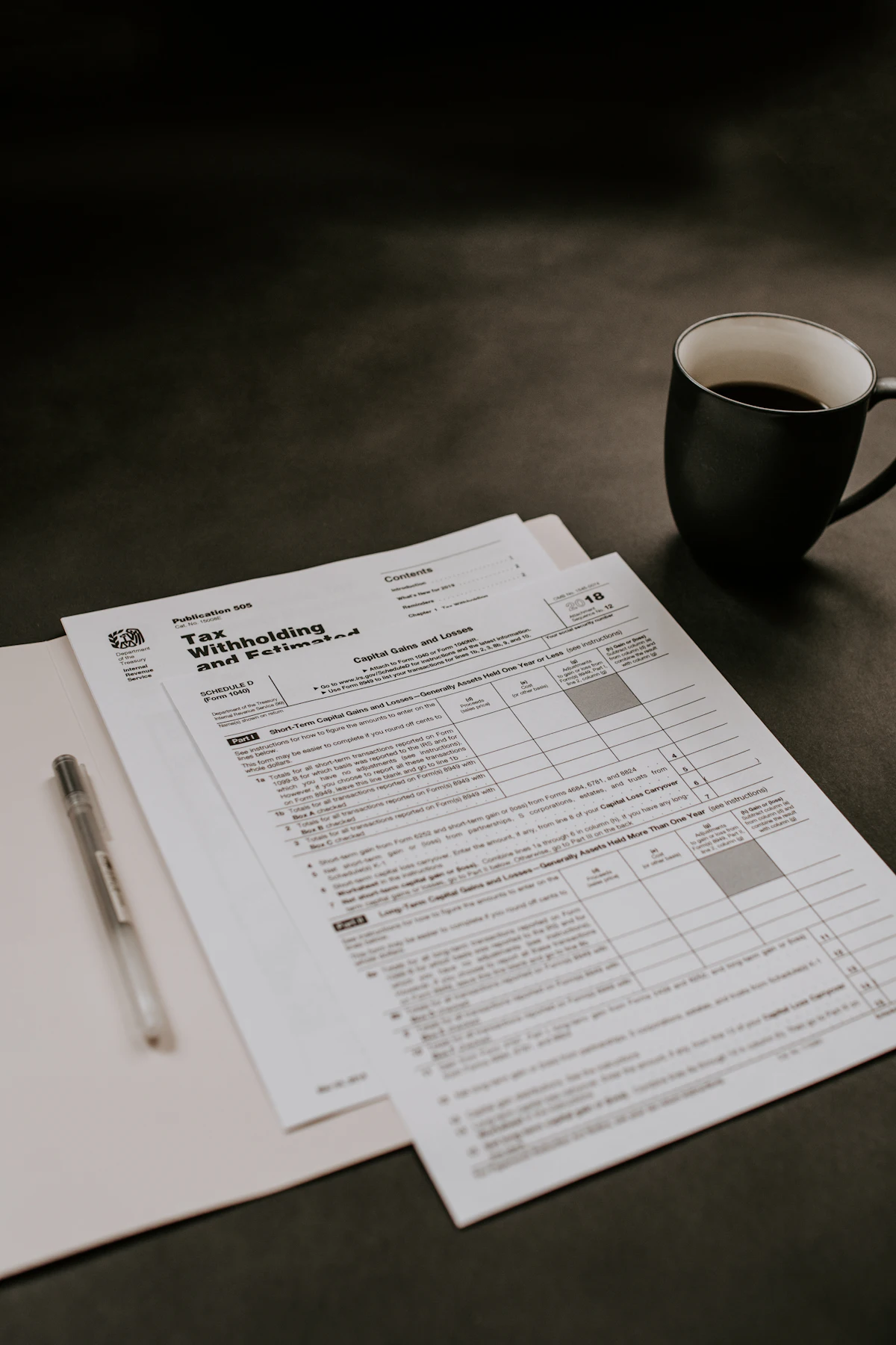 Owner converting invoices to cash at a desk